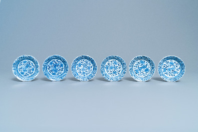 A varied collection of Chinese blue and white cups and saucers, Kangxi