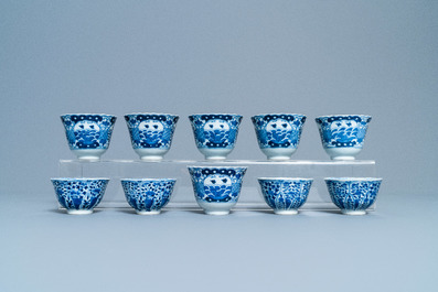 A varied collection of Chinese famille rose and blue and white cups and saucers, Qianlong and 19th C.