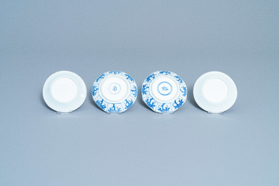 A varied collection of Chinese blue and white cups and saucers, Kangxi