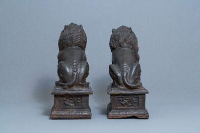 A pair of large Chinese cast iron models of lions, Ming mark and of the period