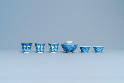 A varied collection of Chinese blue and white cups and saucers, Kangxi