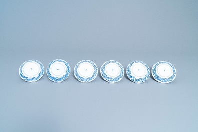 A varied collection of Chinese blue and white cups and saucers, Kangxi