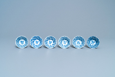 A varied collection of Chinese blue and white cups and saucers, Kangxi