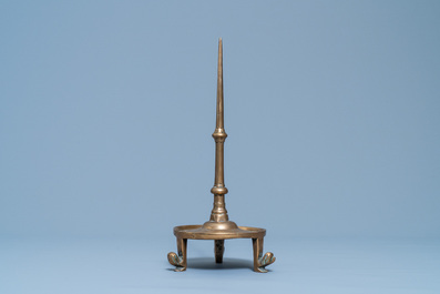 A Flemish or Dutch bronze candlestick, 14/15th C.