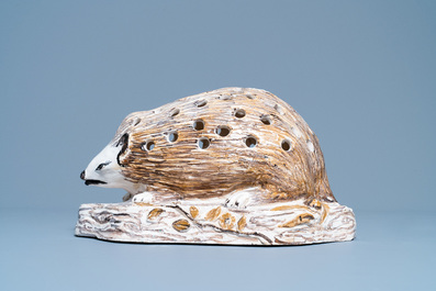 A polychrome faience flower holder shaped as a hedgehog, Northern France, 18/19th C.