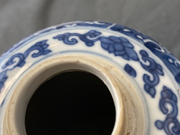 A pair of Chinese blue and white lidded jars with floral design, Kangxi