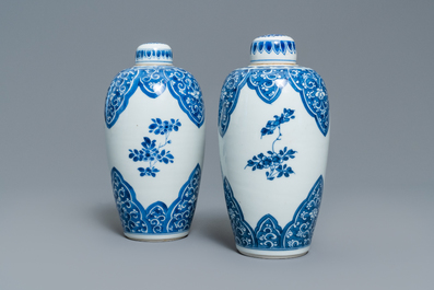 A pair of Chinese blue and white lidded jars with floral design, Kangxi