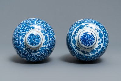 A pair of Chinese blue and white lidded jars with floral design, Kangxi