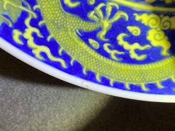 A Chinese underglaze blue and yellow-glazed 'dragon' dish, Qianlong mark and of the period