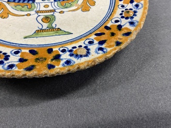 A polychrome Dutch maiolica dish with a fruit tazza, 1st half 17th C.