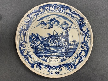 A Dutch Delftware blue and white dish with soldiers at camp, Makkum, dated 1764