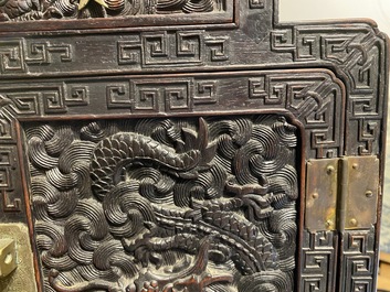 Un petit cabinet en bois sculpt&eacute; &agrave; d&eacute;cor de dragons, Chine, R&eacute;publique