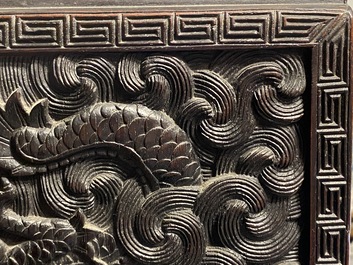 Un petit cabinet en bois sculpt&eacute; &agrave; d&eacute;cor de dragons, Chine, R&eacute;publique