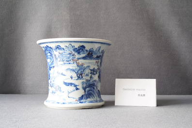 A fine Chinese blue, white and copper red 'Master of the Rocks' brush pot, Kangxi