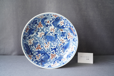 A Chinese blue, white and copper red 'crab and fish' dish, Kangxi