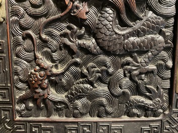 Un petit cabinet en bois sculpt&eacute; &agrave; d&eacute;cor de dragons, Chine, R&eacute;publique