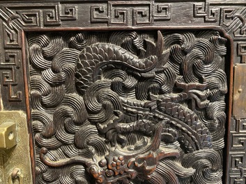 Un petit cabinet en bois sculpt&eacute; &agrave; d&eacute;cor de dragons, Chine, R&eacute;publique