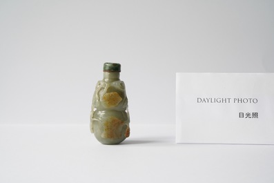 A Chinese gourd-shaped celadon and russet jade snuff bottle, Qing