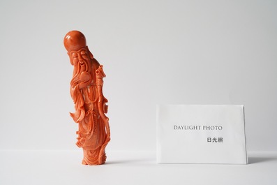 A Chinese carved red coral figure of Shou Lao, 19/20th C.