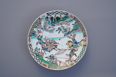 A Chinese famille verte dish with warriors on horseback, Kangxi