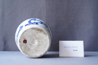 A Chinese blue and white bottle vase with floral design, Transitional period