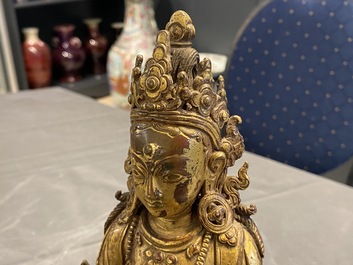 A Nepalese gilt bronze figure of White Tara, 16th C.