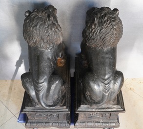 A pair of large Chinese cast iron models of lions, Ming mark and of the period