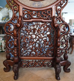 A massive Chinese carved wooden screen with a round famille verte plaque and polychrome lacquer, 19th C.