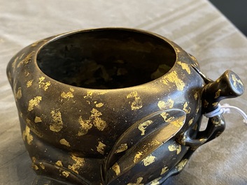 A Chinese gold-splashed bronze peach-form censer, Xuande mark, 18th C.