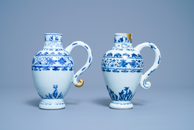 A pair of Chinese blue and white ewers, Transitional period