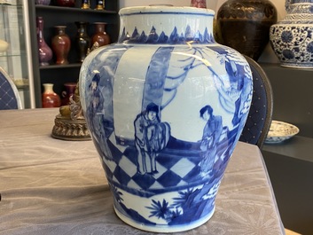 Een Chinese blauw-witte vaas met figuren in een interieur, Kangxi