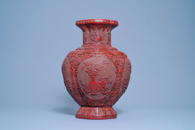 A Chinese carved red lacquer vase, Qianlong mark, 19/20th C.