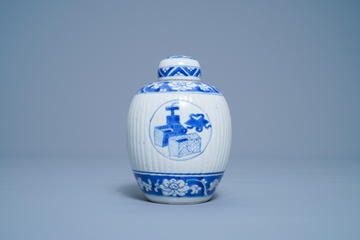 A Chinese ribbed blue and white jar and cover, Kangxi