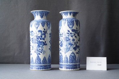 A pair of Chinese blue and white vases with floral designs, Kangxi