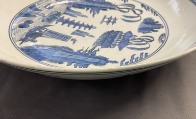 A large Chinese blue and white dish with a landscape with pagoda, Jiajing