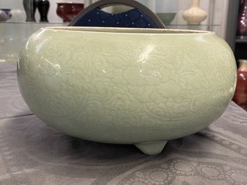 A Chinese celadon-glazed tripod censer with incised underglaze design, Kangxi