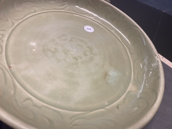 A Chinese Longquan celadon dish with incised floral design, Yuan/Ming