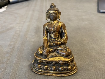 A Sino-Tibetan gilt bronze figure of Buddha Shakyamuni, Ming