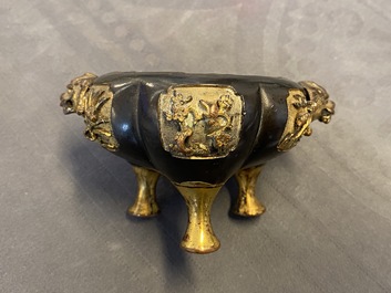 A Chinese lacquered and parcel-gilt bronze tripod censer and cover, Ming