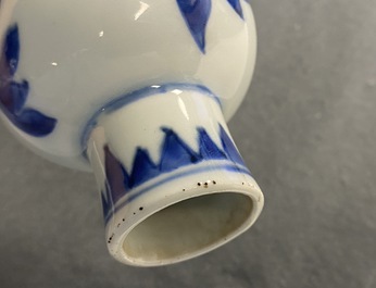 A Chinese blue and white bottle vase with floral design, Transitional period