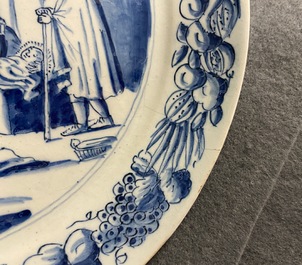 A pair of Dutch Delft blue and white plates with biblical scenes, 18th C.