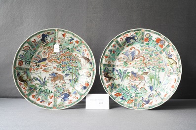 A pair of Chinese famille verte 'mythical beasts' dishes, seal marks, Kangxi