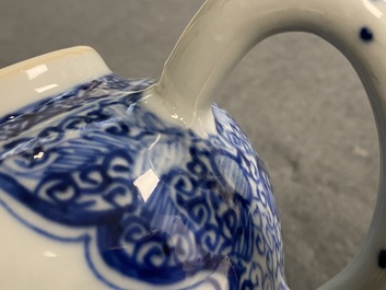 A Chinese blue and white teapot and a pair of wine cups, Kangxi