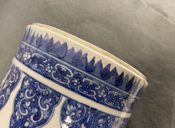 A pair of Chinese blue and white vases with floral designs, Kangxi