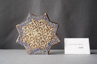 A star-shaped luster-glazed tile, Kashan, Iran, 14th C.