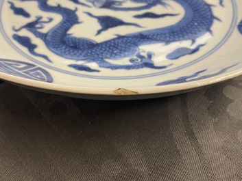 A Chinese blue and white 'dragon and Shou' dish, Yongzheng mark and of the period