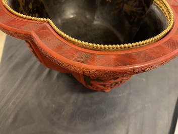 A Chinese quatrefoil jardini&egrave;re in red and black lacquer, Qianlong