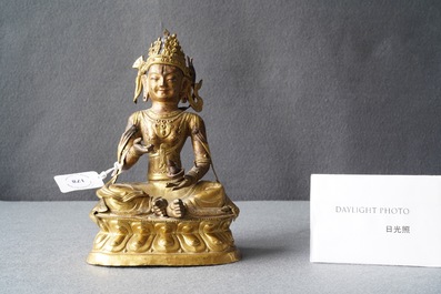 A Sino-Tibetan gilt copper alloy figure of Buddha, 18/19th C.