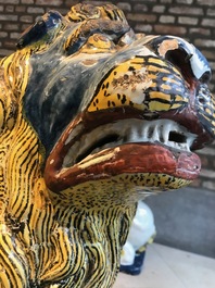 A pair of monumental polychrome Rouen faience models of lions, France, 18th C.