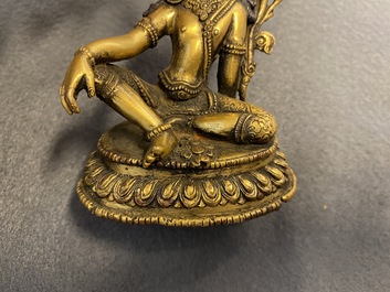 Two Sino-Tibetan gilt bronze figures, 19th C.